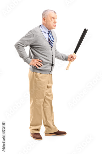 Photo: Full length portrait of an angry middle aged man holding a baseb Full length portrait of an angry middle aged man holding a baseb