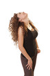 Happy woman looks up at an object directly over her.