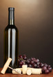 Wine and corks on wooden table on brown background