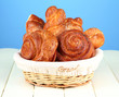 Composition with buns in wicker basket,