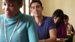 Portrait of happy hispanic man smiling during test at university