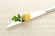 Butter curl on knife, close up