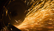 worker cuts a metal pipe
