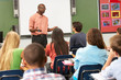 Photo: Teacher Using Interactive Whiteboard During Lesson Teacher Using Interactive Whiteboard During Lesson
