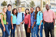 Group Of Teenage Pupils With Teacher Outside Classroom