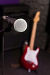 The microphone at the front against the blurred guitar