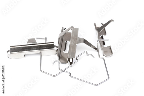 Photo: spring from brake pads , isolatet on white spring from brake pads , isolatet on white