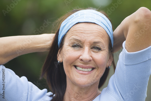 Photo: Happy smiling mature woman outdoor Happy smiling mature woman outdoor