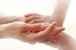 Mother holding a hands of her son