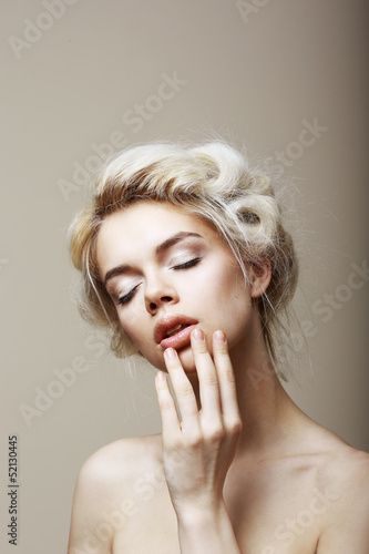 Photo: Purity. Sensual Blond Female with Closed Eyes touching her Face Purity. Sensual Blond Female with Closed Eyes touching her Face