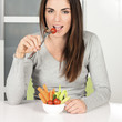 girl eating vegetables