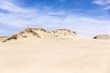 Sand dunes and blue sky with clouds in the national reserve