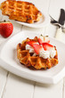 belgian waffles with fresh strawberries and whipped cream