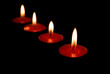 Photo: red candles burning in a dark space red candles burning in a dark space