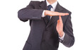 Businessman showing time out sign with hands.