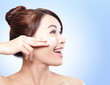 Photo: Woman face and apply cream Woman face and apply cream