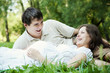 Pregnant wife and her husband laughing