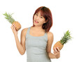 Photo: Isolated young asian woman with pineapple Isolated young asian woman with pineapple