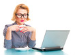 Happy business woman drinking coffee and watching in laptop