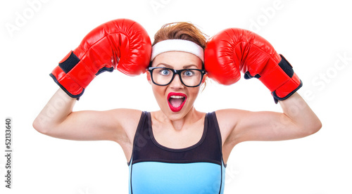Photo: Surprised fitness woman with boxing gloves, isolated on white Surprised fitness woman with boxing gloves, isolated on white
