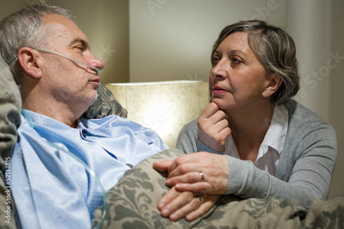 Photo: Senior patient at hospital with worried wife Senior patient at hospital with worried wife
