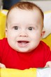 Photo: happy baby in a yellow baby carriage happy baby in a yellow baby carriage