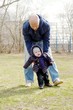 father learns his son to go outdoors in spring