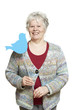 Senior woman holding a social media sign smiling