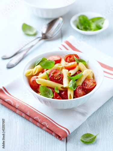 Photo: Penne with roasted cherry tomatoes and basil leaves Penne with roasted cherry tomatoes and basil leaves