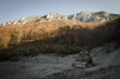 mountain landscape with old house and huge cliffs
