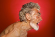 portrait of a screaming man on red background