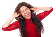 Beautiful young teen slapping ears and smiles