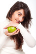Young beautiful woman smiling with a green apple on hands