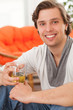 Young happy caucasian man at home