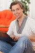 Young happy caucasian man at home