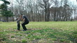 Father and son playing football in the park