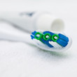 Closeup image of toothbrush and tube