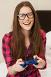 Young woman in casual playing videogame