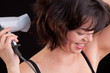 Portrait of beautiful woman, she holding hair dryer