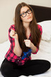 Young woman in casual playing videogame