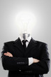 Businessman with lamp instead head