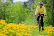 Photo: Bike riding - woman on bike, active adult concept Bike riding - woman on bike, active adult concept
