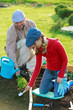 Photo: Gardening, planting - girl helping father in the garden Gardening, planting - girl helping father in the garden