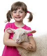 happy little girl with a sheep isolated on a white background