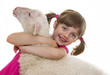 happy little girl with a sheep