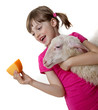 happy little girl with a sheep and a cheese