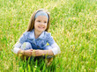 Foto: Cute little girl on the meadow Cute little girl on the meadow