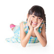 Photo: Portrait of a cute happy little asian girl laying on floor Portrait of a cute happy little asian girl laying on floor