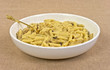 Cooked penne pasta with mushrooms in bowl
