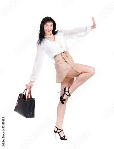 Photo: Dancing brunette lady with handbag Dancing brunette lady with handbag